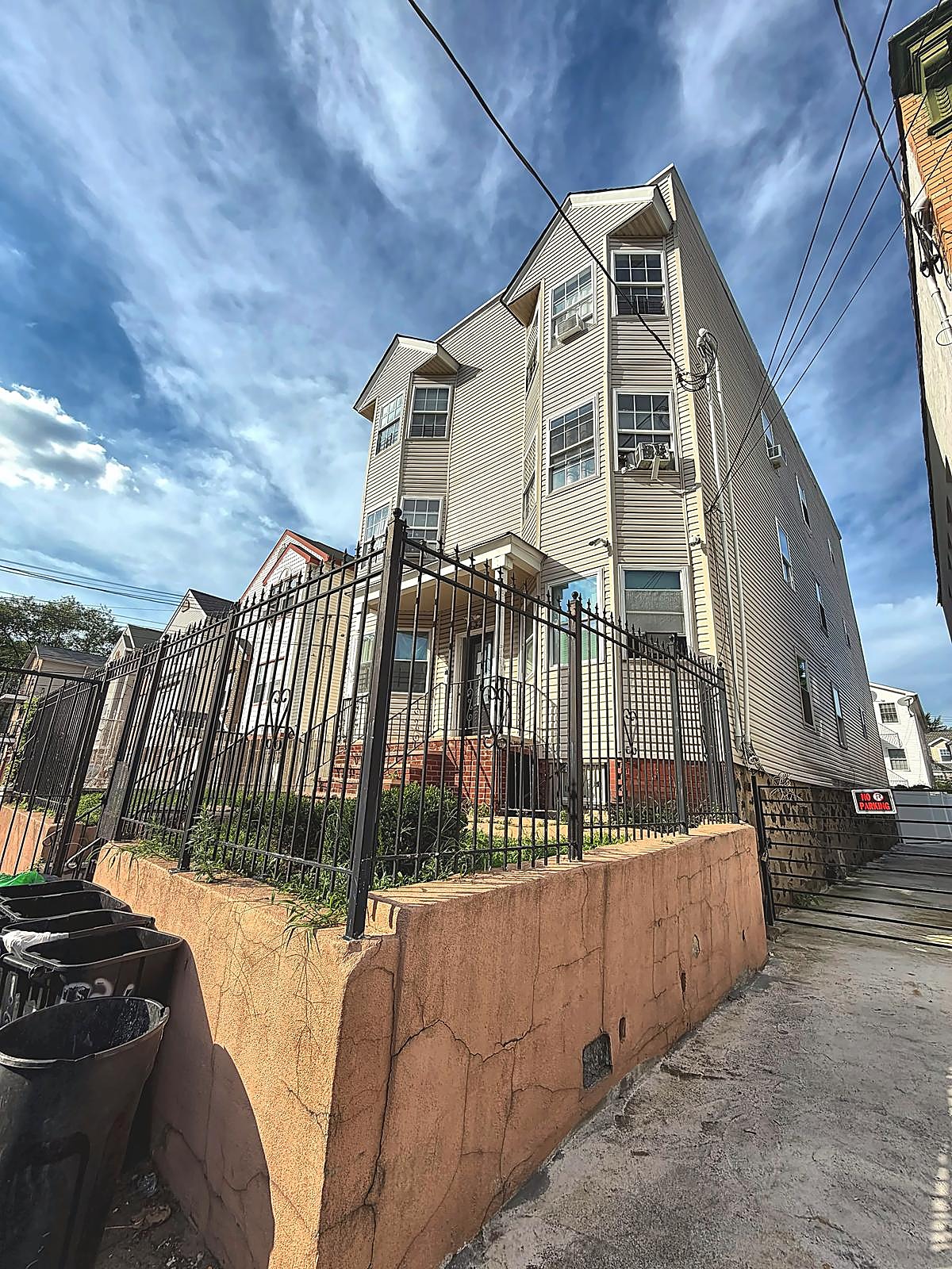 Side view of the building and gated fence