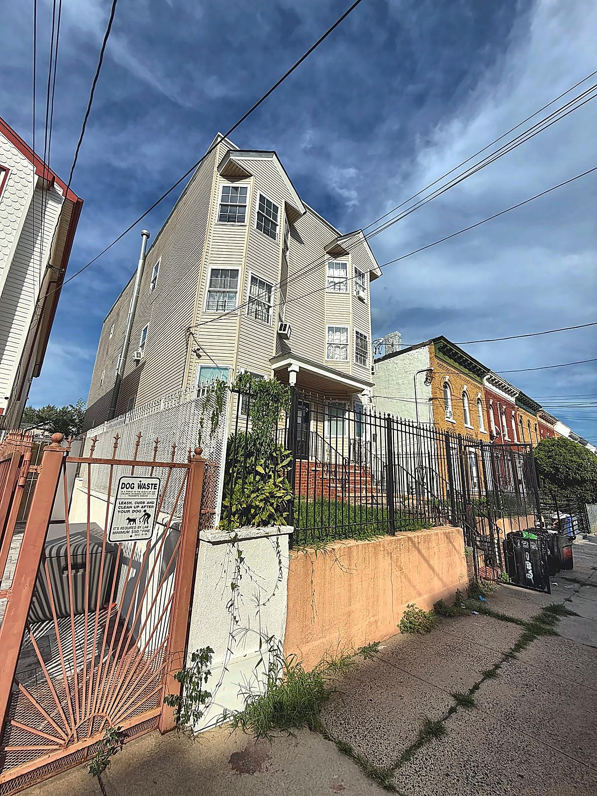 Fenced perimeter and walkway at 132 Wilkinson Ave