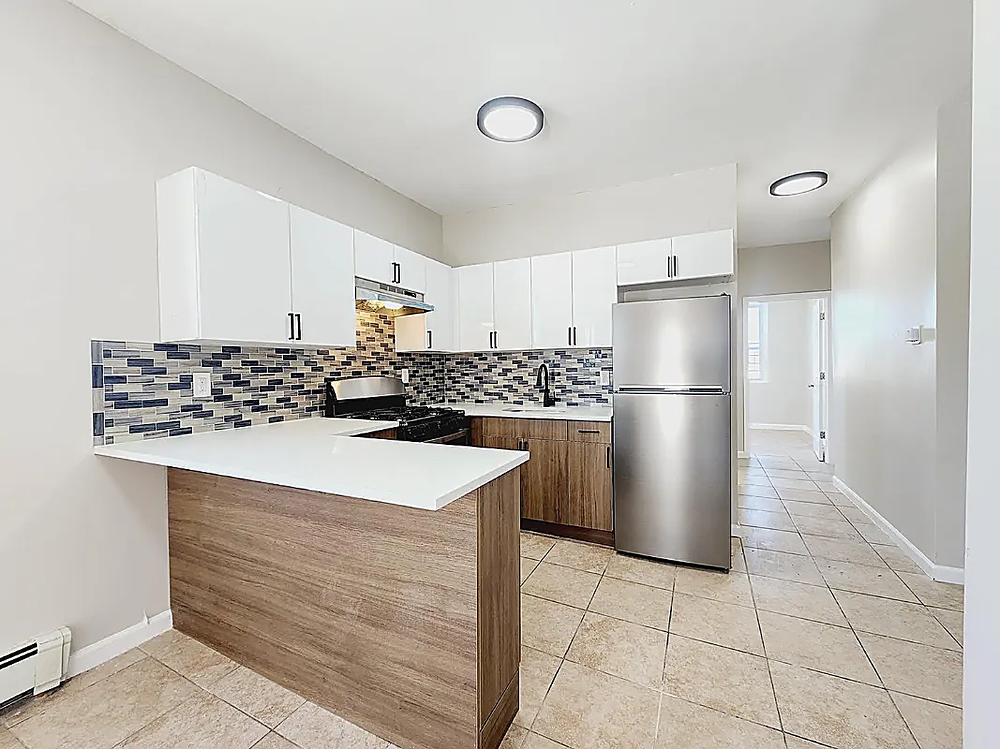 Renovated kitchen with stainless appliances